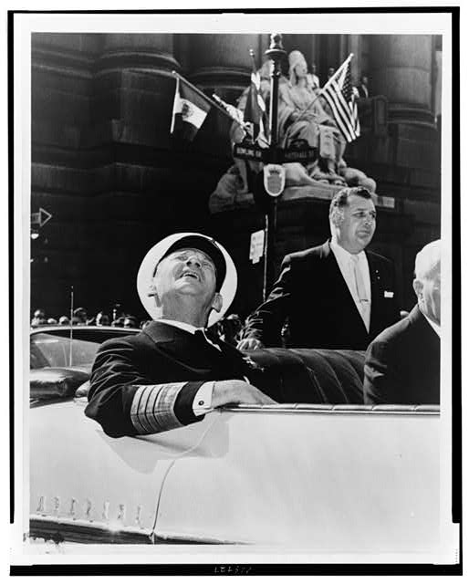 [King Frederick of Denmark, seated in car, looking up, probably during ticker tape parade, New York City]