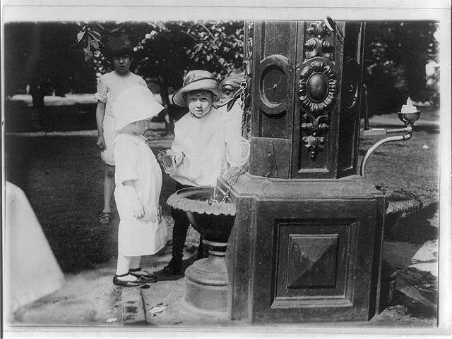 Children at a water fountain, probably in a Washington, D.C., park
