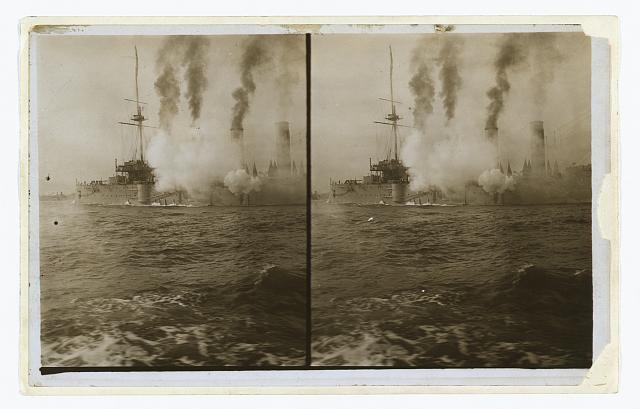 [An American cruiser firing its guns in salute as it arrives in New York, probably at the time of the Portsmouth Peace Conference]