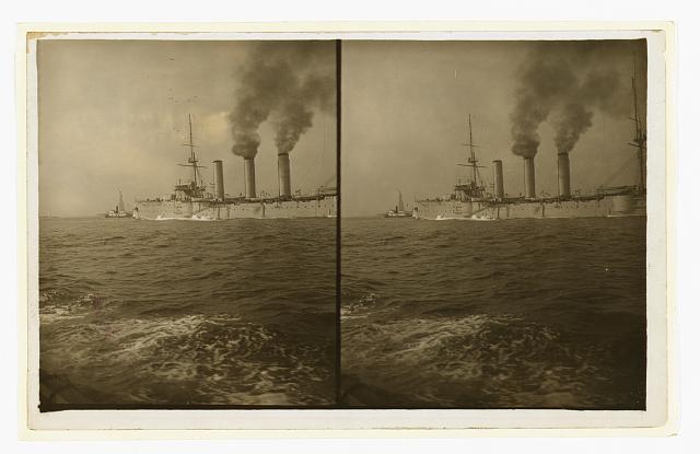 [An American cruiser being guided by a tugboat past the Statue of Liberty, as it arrives in New York, probably at the time of the Portsmouth Peace Conference]