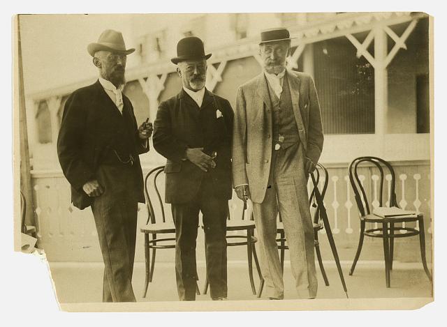 [Three men, probably journalists, full-length portrait, facing front]