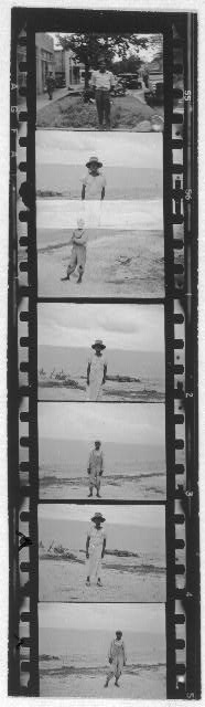 [Portraits of people standing on a beach and one photo of a man standing on a street in town, (probably Belle Glade, Fla.), from Georgia, Florida and Bahamas expedition, 1935]