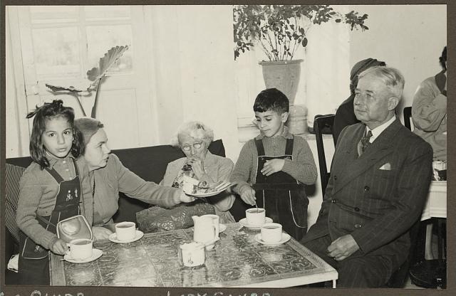 [Mrs. Glubb, Lady Glubb and Glubb Pasha, seated with children, at American Colony bazaar, probably in Jerusalem]