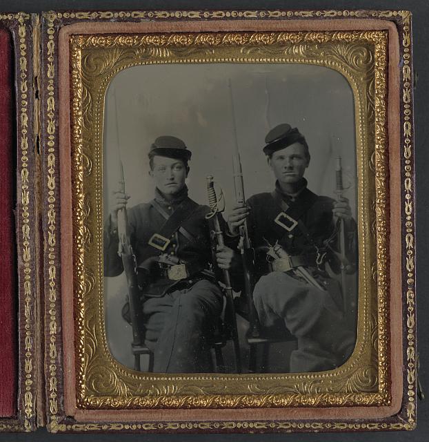 [Two unidentified soldiers with Spencer carbines, 1860 sabers, and Colt Army revolvers, probably Union uniforms]