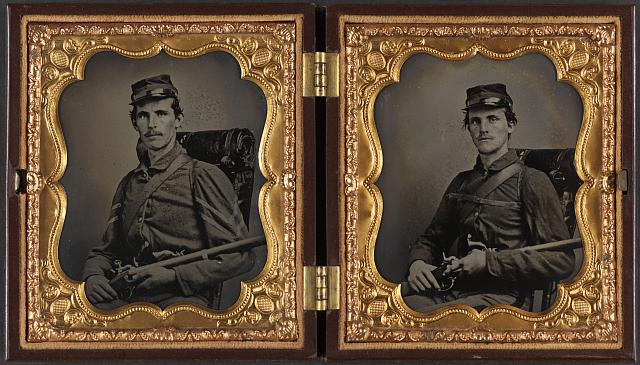 [Two unidentified soldiers, probably brothers, in Union corporal's and private's uniforms with rifle muskets and revolvers]