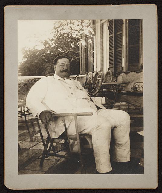 [William H. Taft, seated in a wicker chair, probably during his tenure as Governor-General of the Philippines]