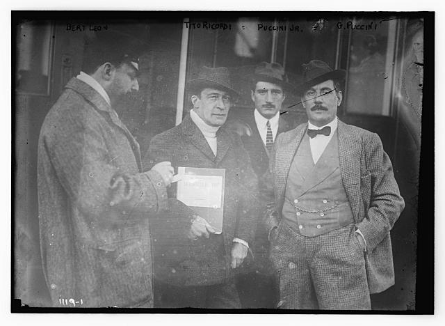 Bert Leon, Tito Ricordi, Puccini Jr., and G. Puccini standing together, probably discussing "La Fanciulla del West"