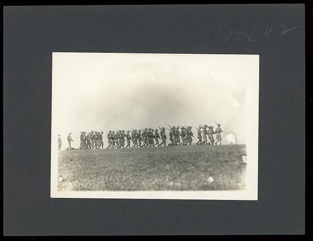 [Soldiers marching with rifles in a field, probably a U.S. Army training exercise in the United States]