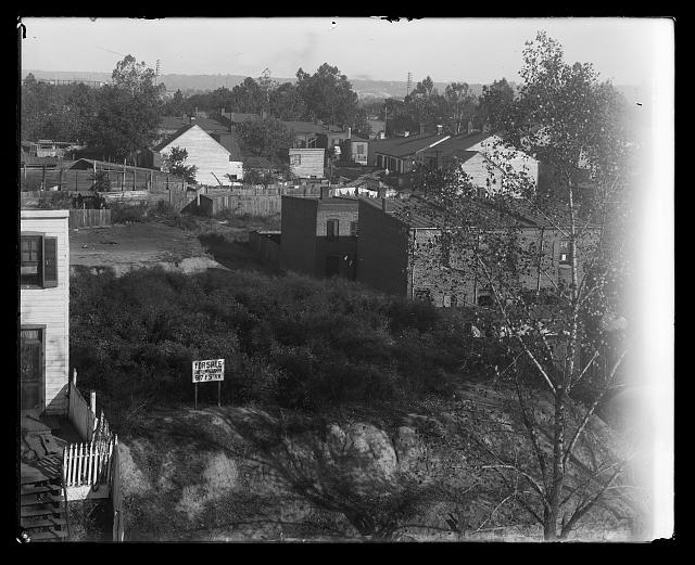 [View of a neighborhood of houses probably in S.W.]