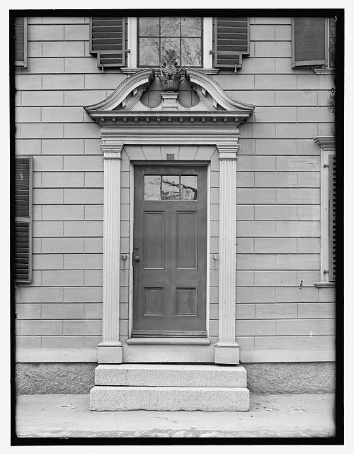 [Doorway with broken pediment surmounted by pineapple, probably Salem, Mass.]