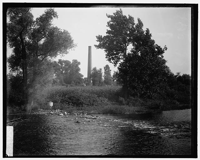 [Smokestack by river, probably the Huron River, Ypsilanti, Michigan]