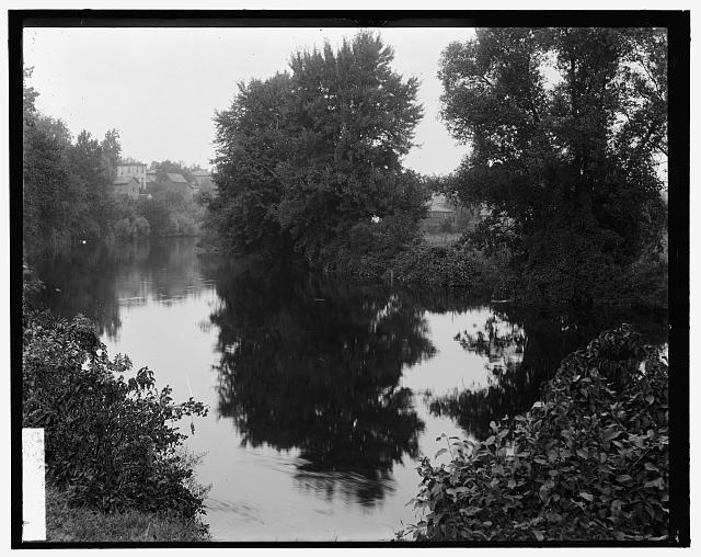 [River with buildings in background, probably the Huron River, Ypsilanti, Michigan]