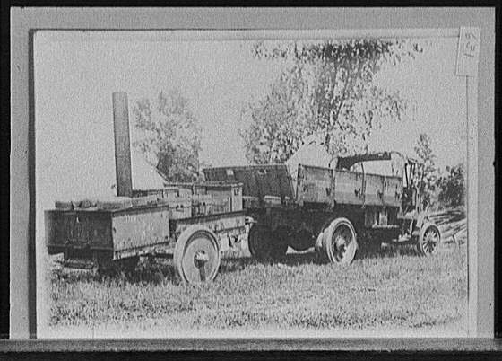 [Highway construction truck and supplies, probably Michigan State Highway Dept., Michigan]