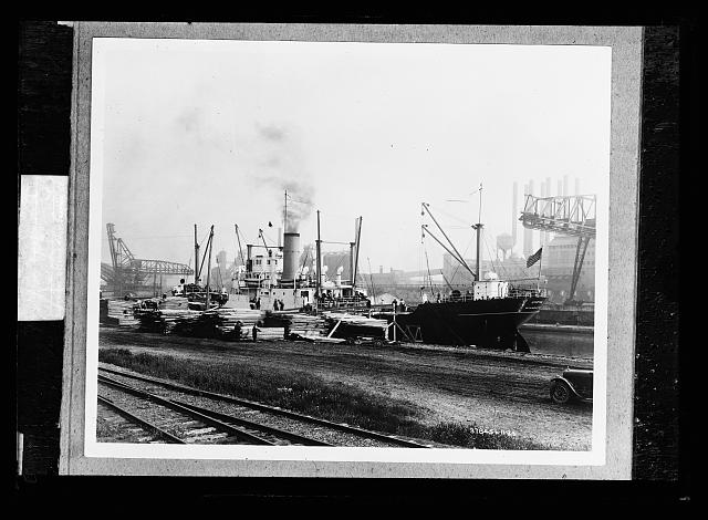 [Freighter at pier with lumber, probably Mich.]