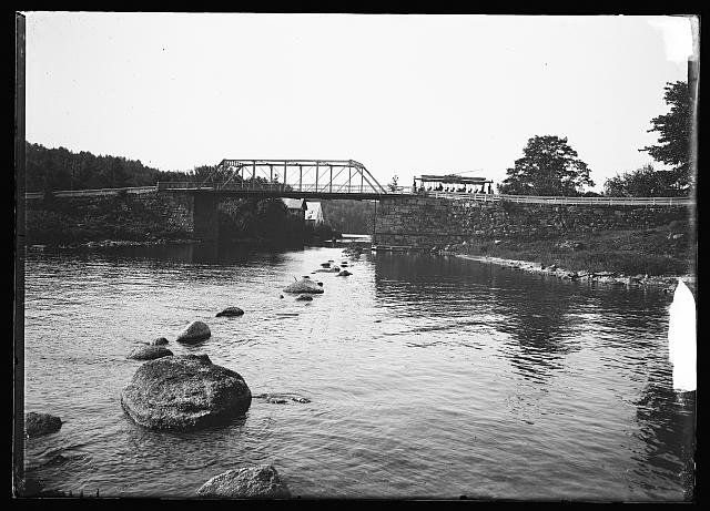 [Bridge and trolley car line by water, probably Lake Winnipesaukee, N.H.]