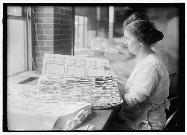 [Woman holding $50 bonds, probably Liberty Bonds. Engraving and Printing, Bureau of Treasury Dept.]