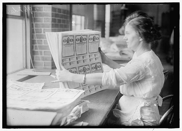 [Woman holding $50 bonds, probably Liberty Bonds. Engraving and Printing, Bureau of Treasury Dept.