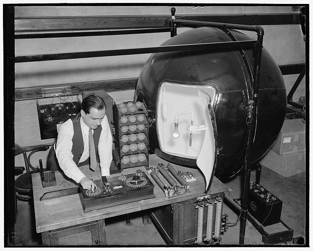 Test electric light bulbs for Uncle Sam. Washington, D.C., March 21. Purchasing on an average of 4,000,000 electric light bulbs annually, Uncle Sam is probably one of the largest users of light in the country. The National Bureau of Standards sees that the government gets value received in purchases by continually testing the incandescent lamps to determine their life and the amount of light they give. Using a special machine designed by the Bureau, Louis Barbrow is shown measuring the amount of light given by a lamp, 3/21/38