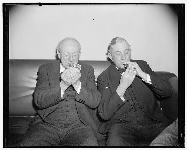 Maybe the reason for the short Senate Democratic Caucus. Washington, D.C., Dec. 31. Probably the Xmas cigars Senators Pat Harrison, of Mississippi, and Tom O'Connally lighted up was the reason for the short Senate Democratic Caucus, which unanimously re-elected Senator Alben W. Barkley of Kentucky as Majority Leader. The harmonious meeting lasted only [...] minutes, 12/31/38