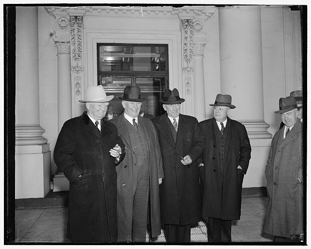 President and Congressional leaders get-together. Washington, D.C., Jan. 9. President Roosevelt today revived his Monday morning White House conferences with the 'big four' of Congress and read to them the special message he is writing on national defense to be sent to Congress probably tomorrow. Leaving the White House are, left to right. Vice President Garner, Senate majority Leader Barkley, speaker Bankhead and House Majority Leader Rayburn, 1/9/39