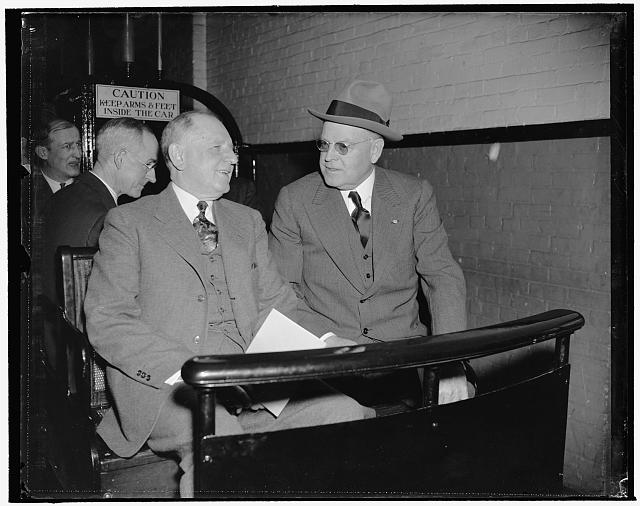 Maybe the Jackson Day dinner invitation. Washington, D.C., Jan. 3. They could be discussing the invitation Senator Warren R. Austin, right, Republican of Vermont and Senate Minority Leader, received for the Jackson Day dinner. At any rate, Senator George L. Radcliff, left, and Senator Austin seem to be enjoying the ride on the Senate subway to the Capitol today for the opening session