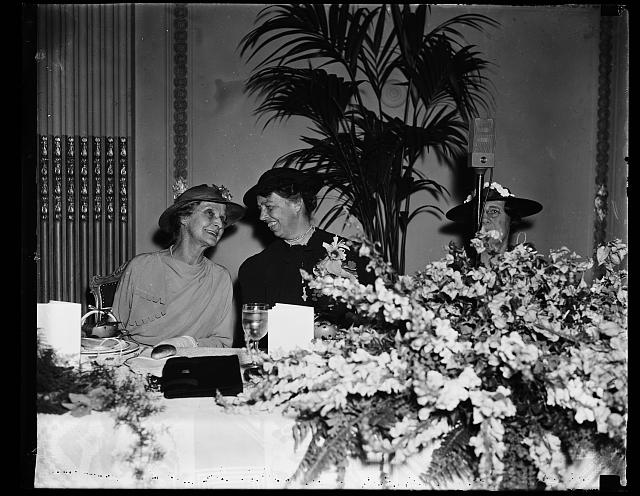 FIRST LADY AND WIFE OF CHIEF JUSTICE BREAKFAST TOGETHER. WASHINGTON, D.C. APRIL 22. BREAKFASTING TODAY AS GUESTS OF THE CONGRESSIONAL CLUB, MRS. ROOSEVELT AND MRS. CHARLES EVANS HUGHES, WIFE OF THE CHIEF JUSTICE, SEEMED TO BE ENJOYING AN 'OFF-THE-RECORD' CHAT. MAYBE THEY'RE DISCUSSING THE PACKING OF THE SUPREME COURT. THE BREAKFAST, WHICH IS GIVEN ANNUALLY IN HONOR OF THE PRESIDENT'S WIFE, WAS FIRST ESTABLISHED DURING THE WILSON ADMINISTRATION
