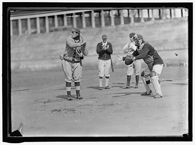 [Jack Calvo at bat, Vic Bickers (maybe) in dark sweater holding bat, Al Scheer left of catcher, Washington AL, at University of Virginia, Charlottesville (baseball)]