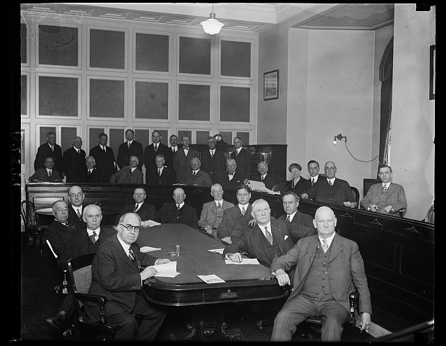 House Committee on Committees meets to consider abolishment of Navy House Committees. This is probably the first picture to be made of the House committee on Committees who met today to consider the abolishment of fifteen standing committees of the House of Representatives in the interest of the economy. The [...] who are leading the fight for abolishing the committees [...] Tilson of Connecticut, Republican [..] Leader, (second from right center) and Rep. [...] Illinois, second from left, center row. These [...] chairmen of the Committee on Committees