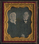 [Unidentified couple, probably husband and wife, three-quarter portrait, seated]