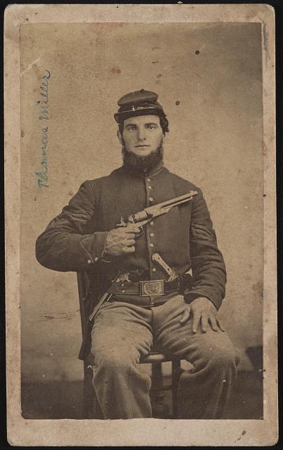 [Thomas Miller, soldier with unidentified regiment, probably from Ohio, in Union cavalry uniform with two pistols and a knife]