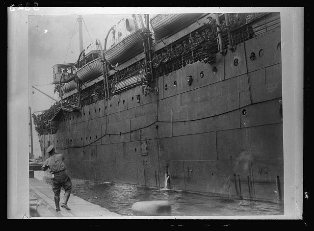 [Soldiers on board ship, probably going to (or arriving in) Europe because they don't have overseas hats]