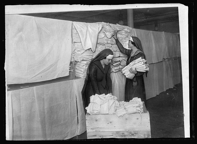 The beginning of the journey. Packing a Red Cross box at a chapter workroom. There are probably 15,000 such starting points for Red Cross journeys