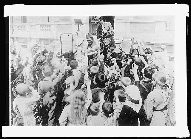 Children at Chateau des Halles. ARC hospital for refugee and repatrie children near Lyon, welcoming a new ARC worker who has just arrived. He is a dentist and then being so happy to see him probably indicates their unfamiliarity with the attentions of dentists