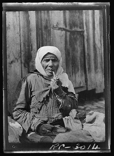 A real joy smoke. Probably no pipe smoker in the world gets any more pleasure from smoking than the Serbian women. Nearly all the older peasant women carry their pipes and never outlook an opportunity to sit down and enjoy a good smoke. This old woman calls every few days to see her daughter who is a patient in the American Red Cross hospital in Belgrade. Always after making her visit she sits down outside the hospital and lights her pipe to think over the strange things she has seen in the American institution