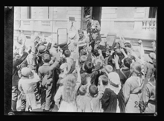 Children at Chateau des Halles. A.R.C. Hospital for refugee and repatrie children near Lyon, welcoming a new A.R.C. worker who has just arrived. He is a dentist and their being so happy to see him probably indicates their unfamiliarity with the attention of dentists