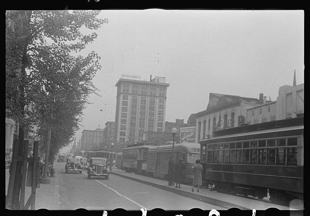 Washington, D.C. A street scene, probably 14th Street, showing automobile and street car traffic. The People's Life Insurance Company appears in background