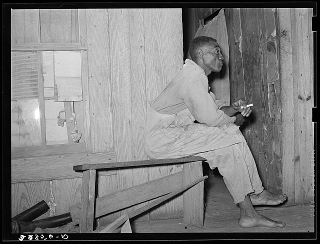Negro strawberry sharecropper on front porch of his home near Hammond, Louisiana. He said that in a good year he came out with maybe two hundred dollars