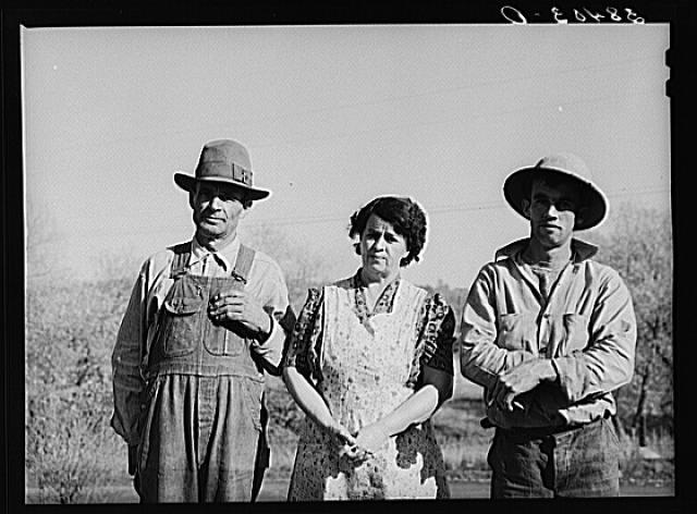 Fruit farmer, his wife and son. Placer County, California. He has owned his eighty acre farm for about thirty-four years. "It's pretty but what's it good for? The trees aren't worth the land they stand on," he says. Has Federal Land Bank loan which he will probably not be able to pay and expects to lose his farm soon
