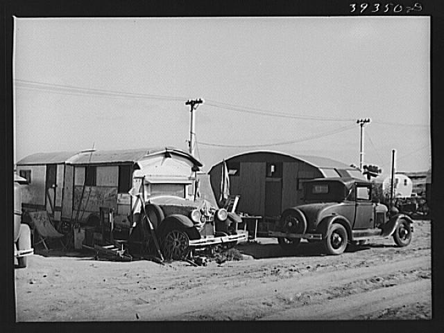 Trailer in trailer court. This trailer is obviously unmovable and because this court is assuming the characteristics of a shack town and because the sanitary facilities are inadequate, it will probably be condemned by board of health. San Diego, California