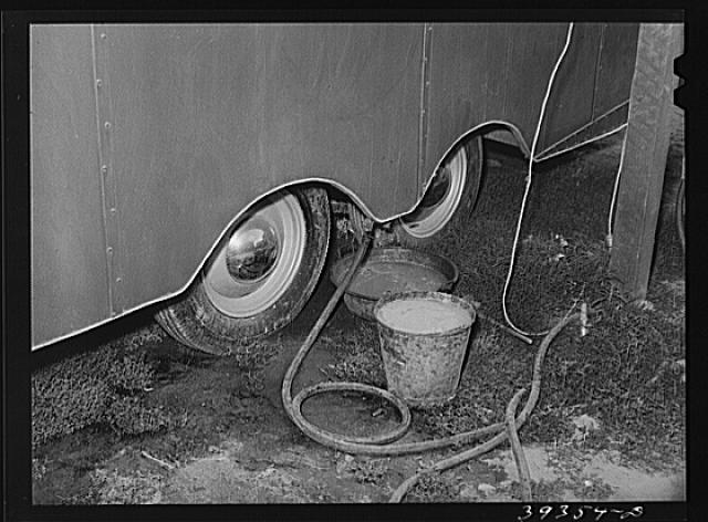 Water from sink in trailer collected in bucket and pan under trailer. This water stands here and spills over on the ground. Such an arrangement is contrary to public health requirements for trailers courts in San Diego and the court will probably be condemned. San Diego, California