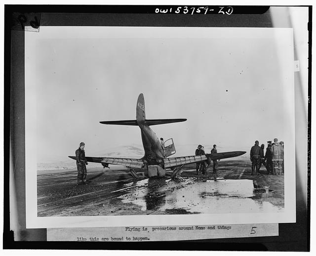 Nome, Alaska. A wrecked plane, probably at the Alaska wing base of the Air Transport Command