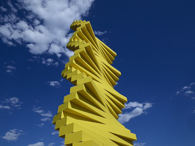 Herbert Bayer is probably best known in Denver, Colorado, for his canary-yellow sculpture "Articulated Wall," a constructivist composition erected in 1985, the year he died. Located within the Denver Design Center complex, the tower rises more than fifty feet. The sculpture's stacked horizontal concrete bars are anchored by an enormous steel armature