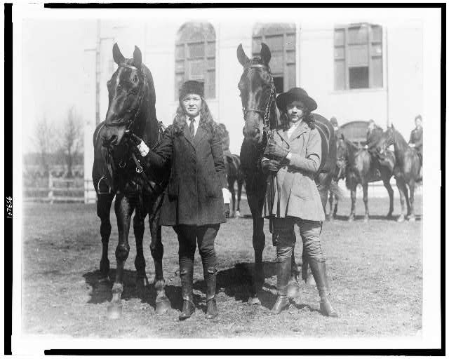 [Lucy Leffingwell, daughter of Russell C. Leffingwell, and Carolyn Chamberlain, daughter of General J.C. Chamberlain, posed with their horses, probably in New York City area]