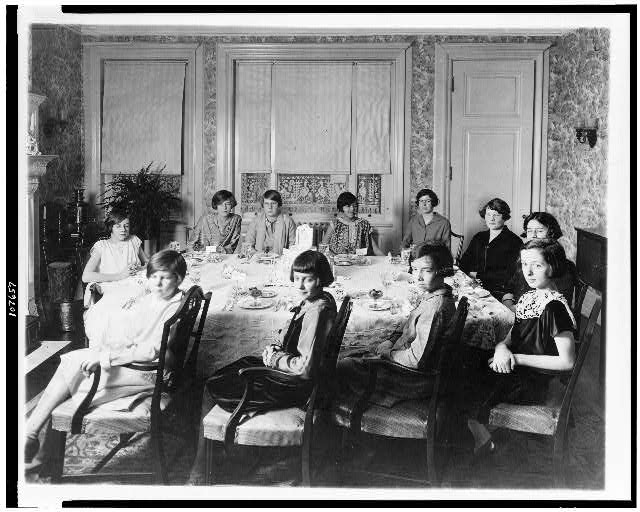 [Eleven girls seated around dining room table, probably a birthday party held in Washington, D.C.]