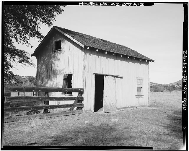 2.  BARN. VIEW  LOOKING NORTHWEST. THE ROLLING DOOR PROBABLY REPLACES AN ORIGINAL 4/4 DOUBLE-HUNG WINDOW. - Tonto Ranger Station, Barn, Forest Service Road 65 at Tonto Wash, Skull Valley, Yavapai County, AZ