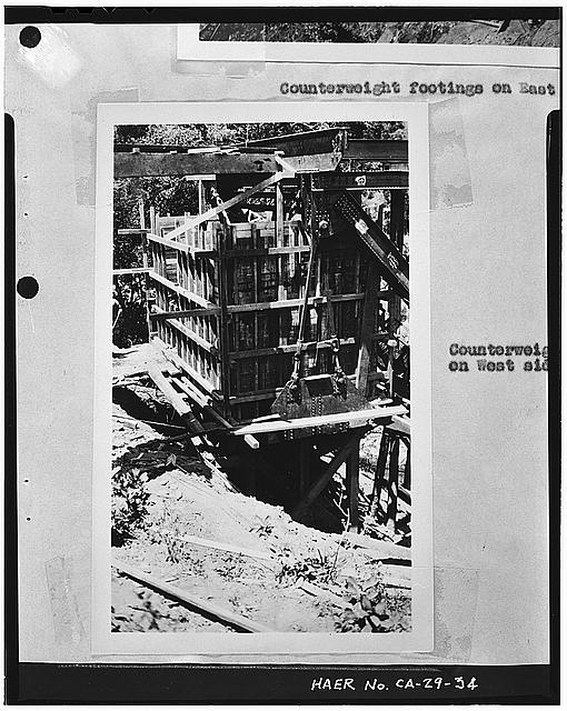COUNTERWEIGHT ON WEST SIDE. View is to the northwest of counterweight on Humboldt County end of bridge, probably taken from the old suspension bridge - South Fork Trinity River Bridge, State Highway 299 spanning South Fork Trinity River, Salyer, Trinity County, CA