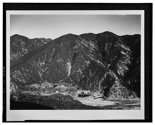 41.  SAR-2, GENERAL VIEW OF POWERHOUSE AND HOUSING AREA FROM THE NEW TRAIL ACROSS THE CANYON. SCE negative no. 4320, no date (but probably March 15, 1918: see HAER no. CA-130-44, no. 4321). Photograph by G. Haven Bishop. - Santa Ana River Hydroelectric System, Redlands, San Bernardino County, CA