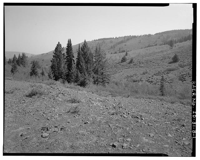 1.  HISTORIC ROADWAY 2. NOTTINGHAM AREA ON FAR HILLSIDE AND PROBABLY OUT OF THE IMAGE TO RIGHT. CAMERA POINTED NORTHEAST. - Florida Mountain Mining Sites, Historic Roadway No. 2, West flank Florida Mountain, East of Rich Gulch Mine & Mill, Silver City, Owyhee County, ID