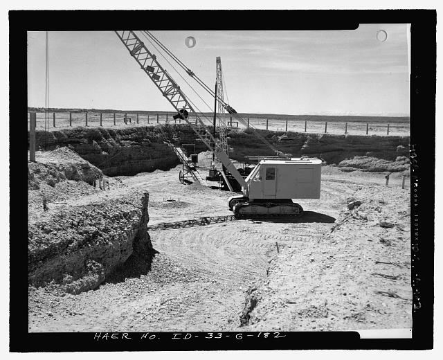 CUTS FOR MTR EXCAVATION ILLUSTRATE SEDIMENTARY MANTLE OF SOIL AND GRAVEL OVERLAYING LAVA ROCK FIFTY FEET BELOW.  SAGEBRUSH HAS BEEN SCOURED FROM REST OF SITE.  CAMERA PROBABLY FACES SOUTHWEST.  INL NEGATIVE NO. 67.
Unknown Photographer, 6/4/1950 - Idaho National Engineering Laboratory, Test Reactor Area, Materials & Engineering Test Reactors, Scoville, Butte County, ID