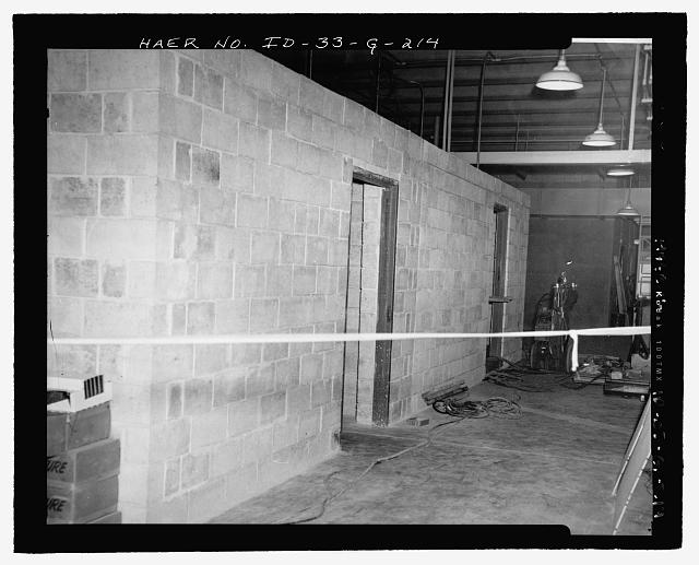 MTR BASEMENT.  DOORWAY TO SOURCE STORAGE VAULT IS AT CENTER OF VIEW; TO DECONTAMINATION ROOM, AT RIGHT.  PART OF MAZE ENTRY IS VISIBLE INSIDE VAULT DOORWAY.  INL NEGATIVE NO. 7763.
Unknown Photographer, photo was dated as 3/30/1953, but this was probably an error.  The more likely date is 3/30/1952. - Idaho National Engineering Laboratory, Test Reactor Area, Materials & Engineering Test Reactors, Scoville, Butte County, ID